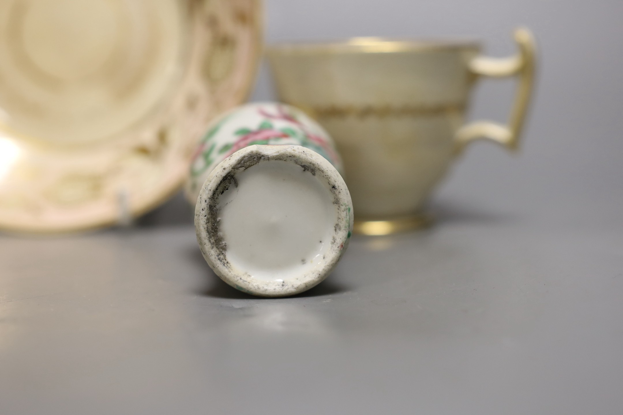 A Chinese famille rose tea bowl, similar small vase and a London shape coffee cup and saucer